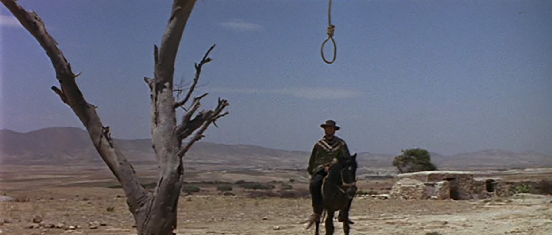 A still from 'the good the bad and the ugly' with noose imagery.