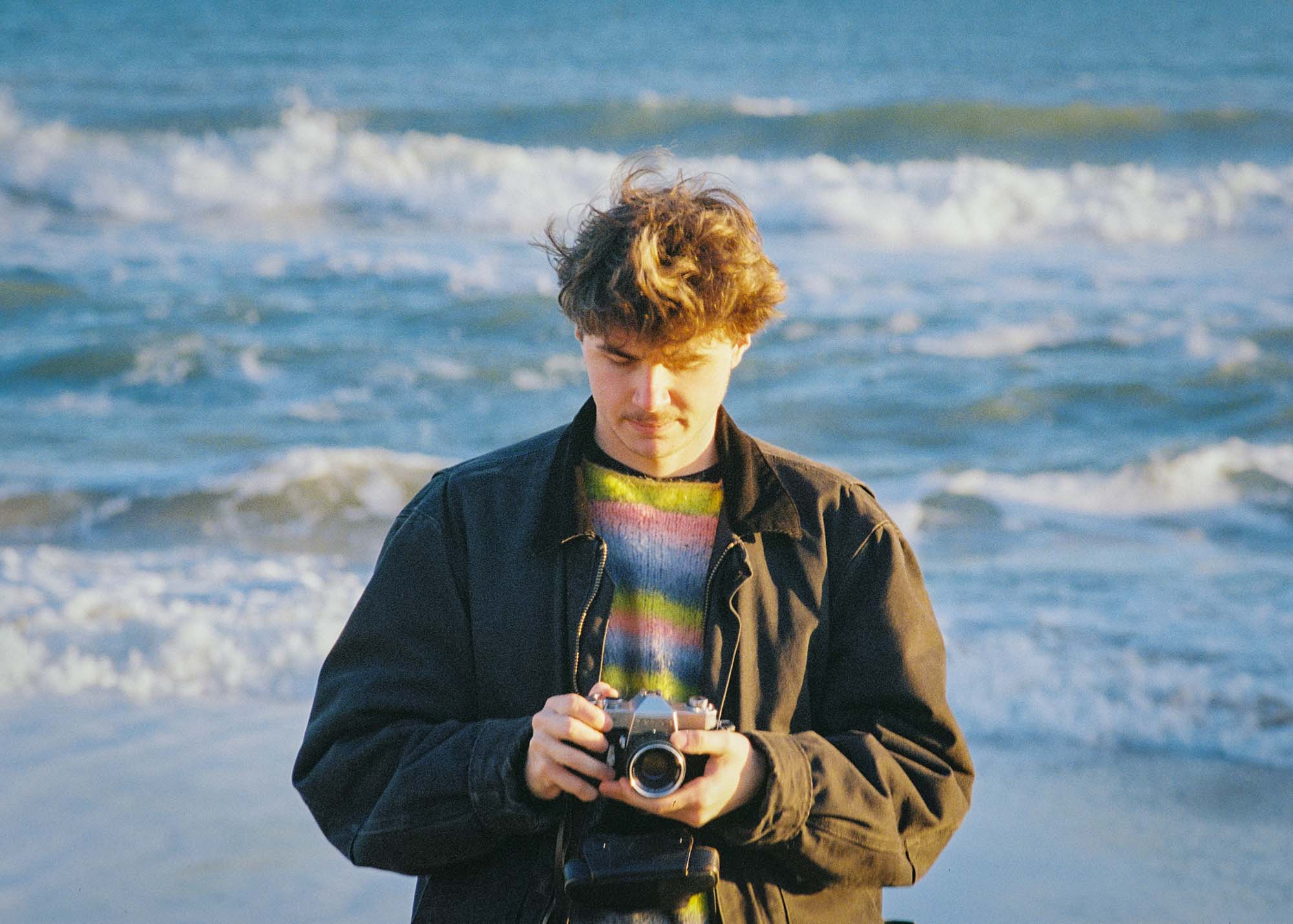 Andy on the beach by the sea.